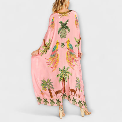 Linda - Pôsobivé šaty s asymetrickými ramienkami a potlačou kokosových paliem